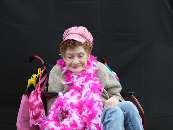 Woman with disabilities smiling in a scarf