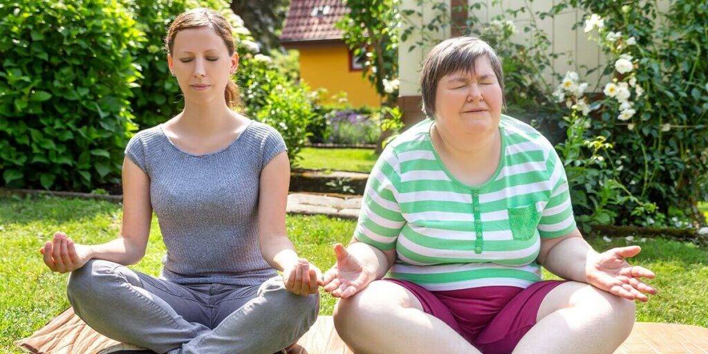 caretaker conducting yoga meditation