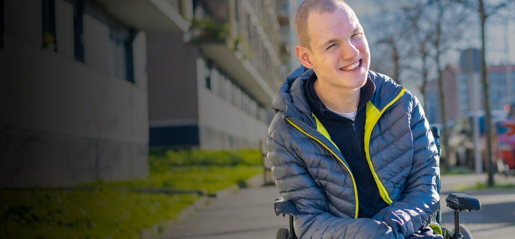 caucasian-young-male-in-a-wheelchair-cheerfully-sm-2026-01-08-00-29-42-utc